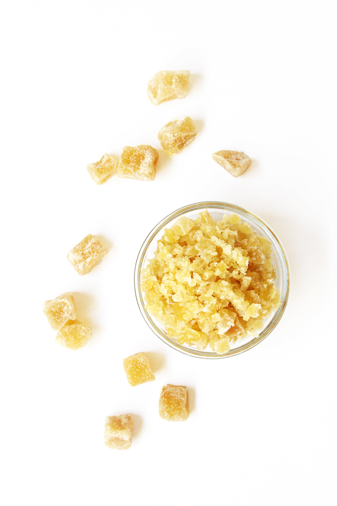 Image from above of candied ginger pieces surrounding a bowl of chopped ginger for Miss Jones Baking Co Ginger Oatmeal Drop Cookies recipe