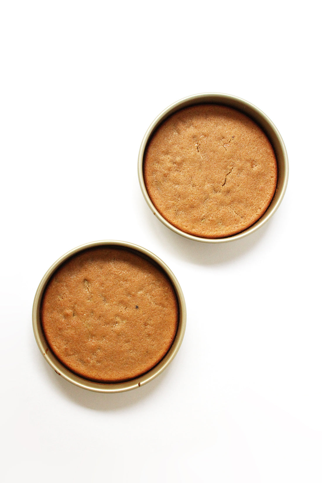 Image from above of two Miss Jones Baking Co Classic Hummingbird Cakes in cake pans