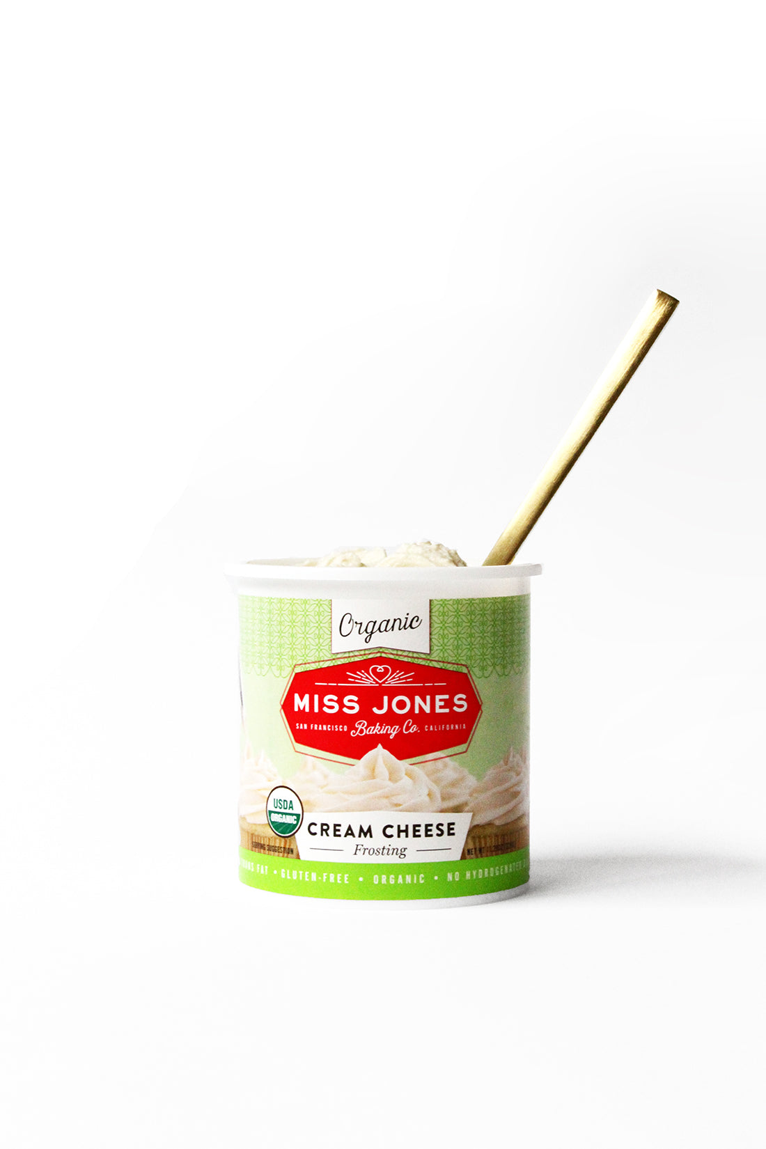 Image of Miss Jones Baking Co Cream Cheese Frosting with a gold spoon inside used for Miss Jones Baking Co Classic Hummingbird Cake