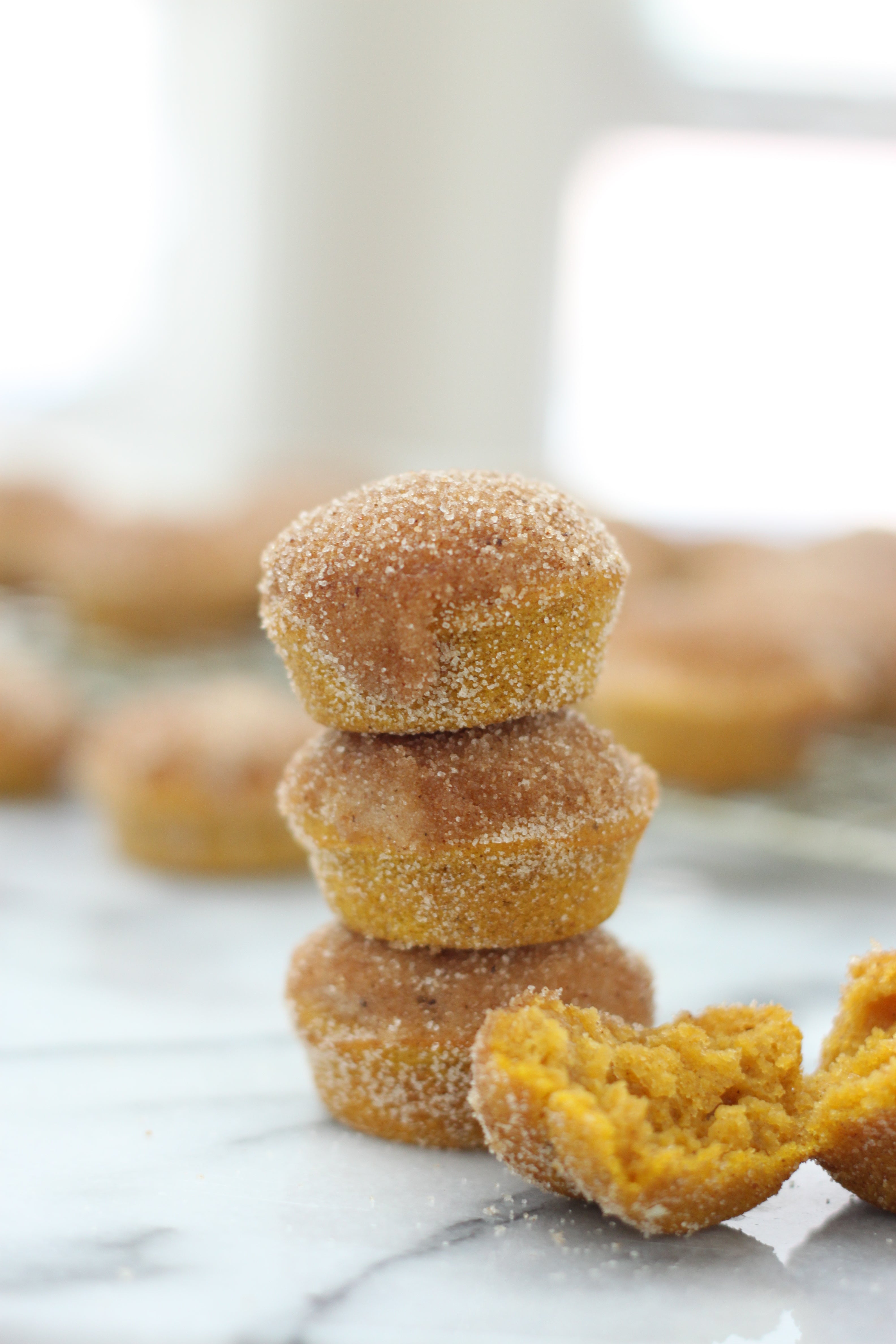 Image of side of three stacked Miss Jones Baking Co Mini Pumpkin Donut Muffins