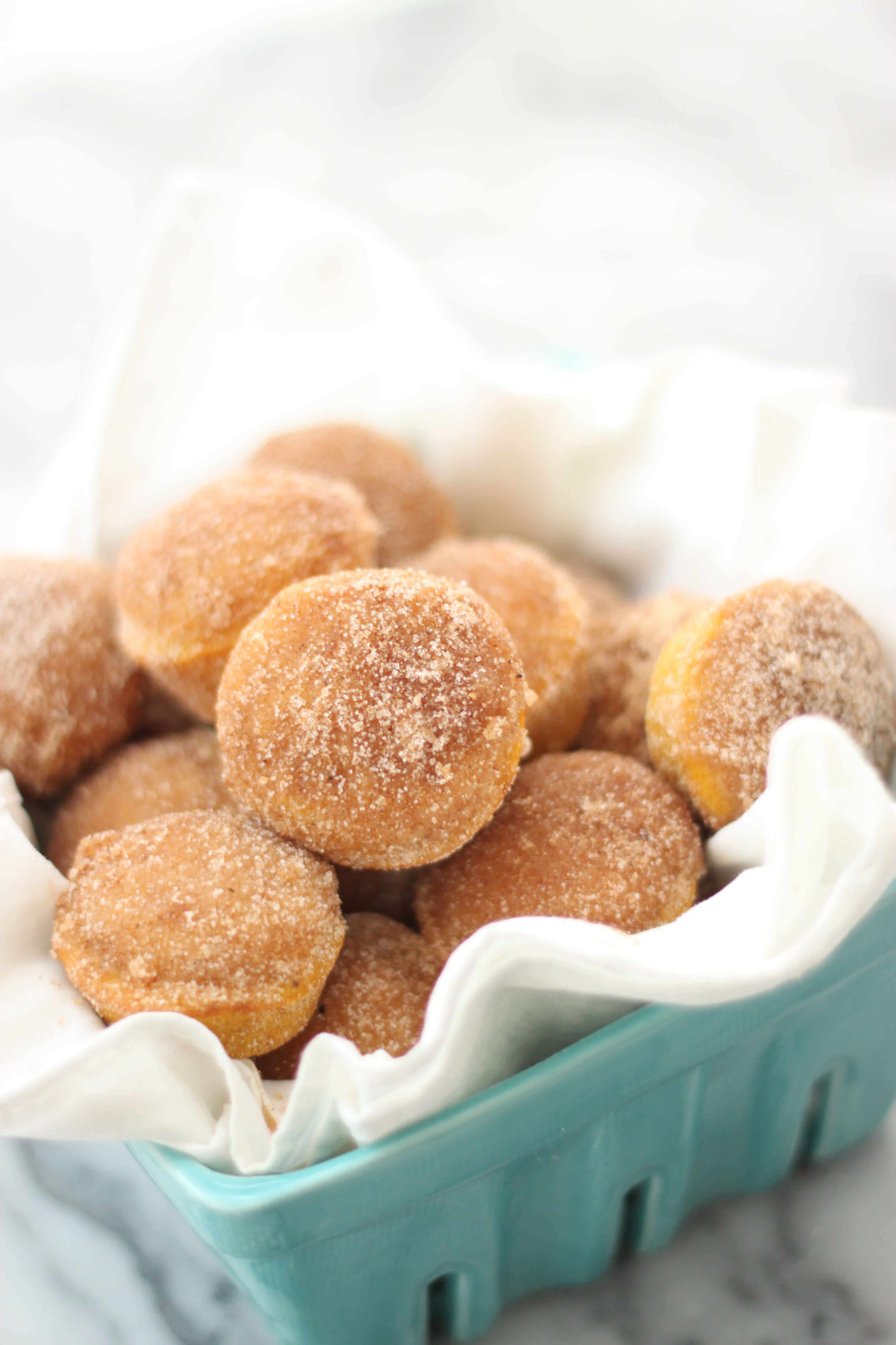 Image of Miss Jones Baking Co Mini Pumpkin Donut Muffins in a blue basket