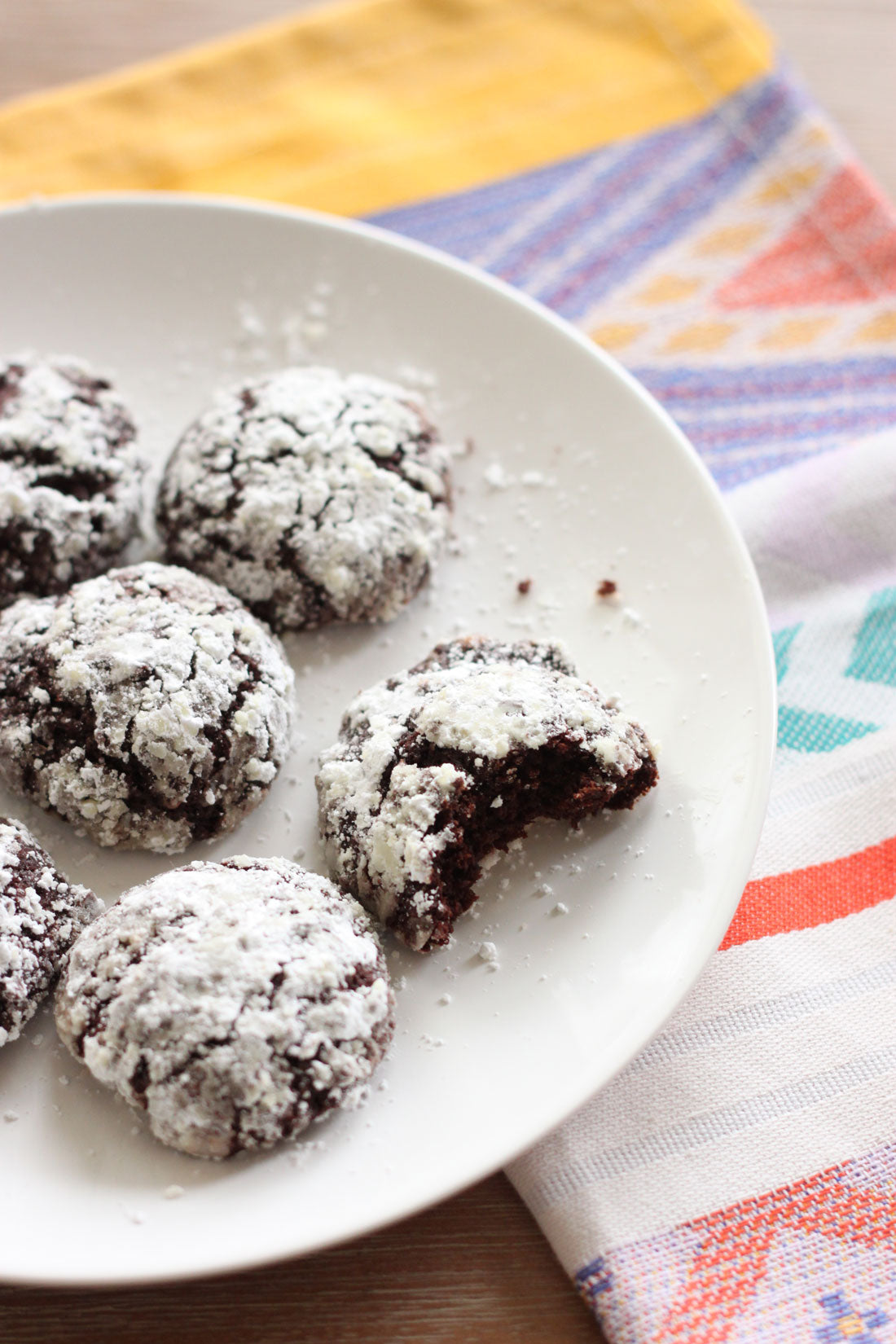 Part of a plate with six Miss Jones Baking Co Chocolate Cake Mix Crinkle Cookies