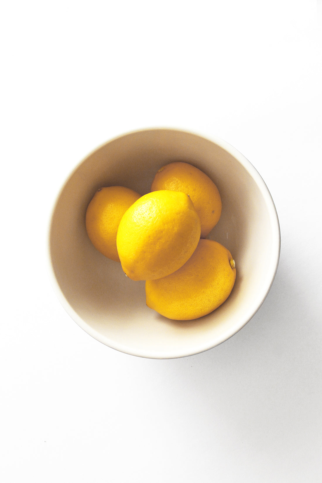 A bowl of four lemons from above for Miss Jones Baking Co Lavender Lemon Bars Recipe