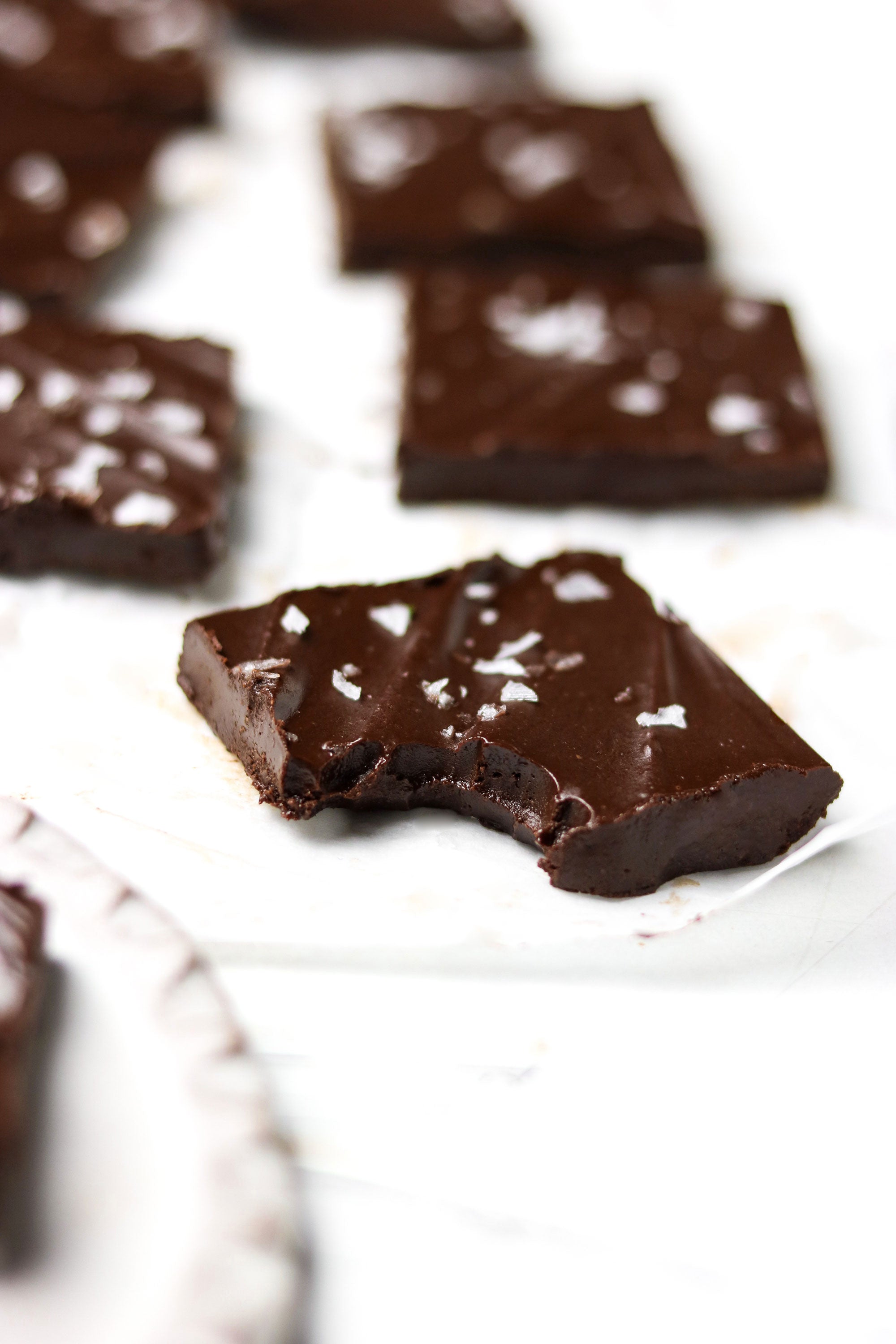 Close up image of a piece of Miss Jones Baking Co Paleo Fudge with a bite removed