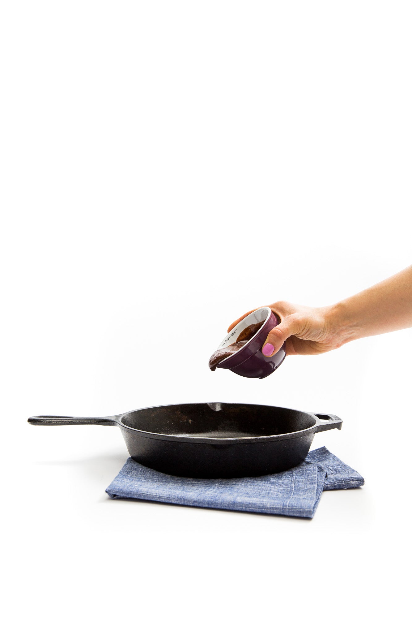 Image of Miss Jones Baking Co Double Chocolate Stout Pancakes batter being poured into a skillet