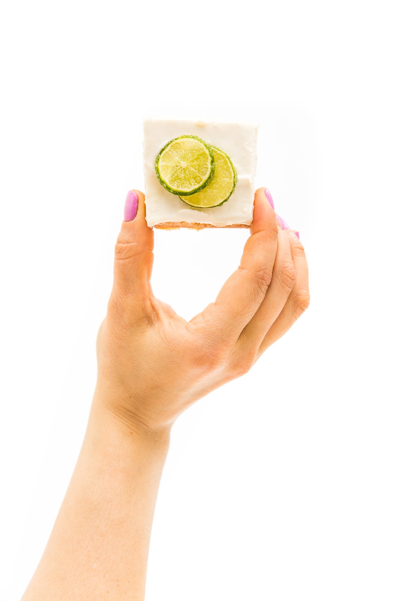 Image of a hand holding a Miss Jones Baking Co Key Lime Margarita Bar