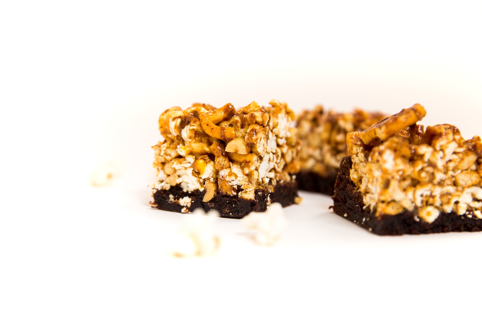 Image of the side of three Miss Jones Baking Co Popcorn Brownies