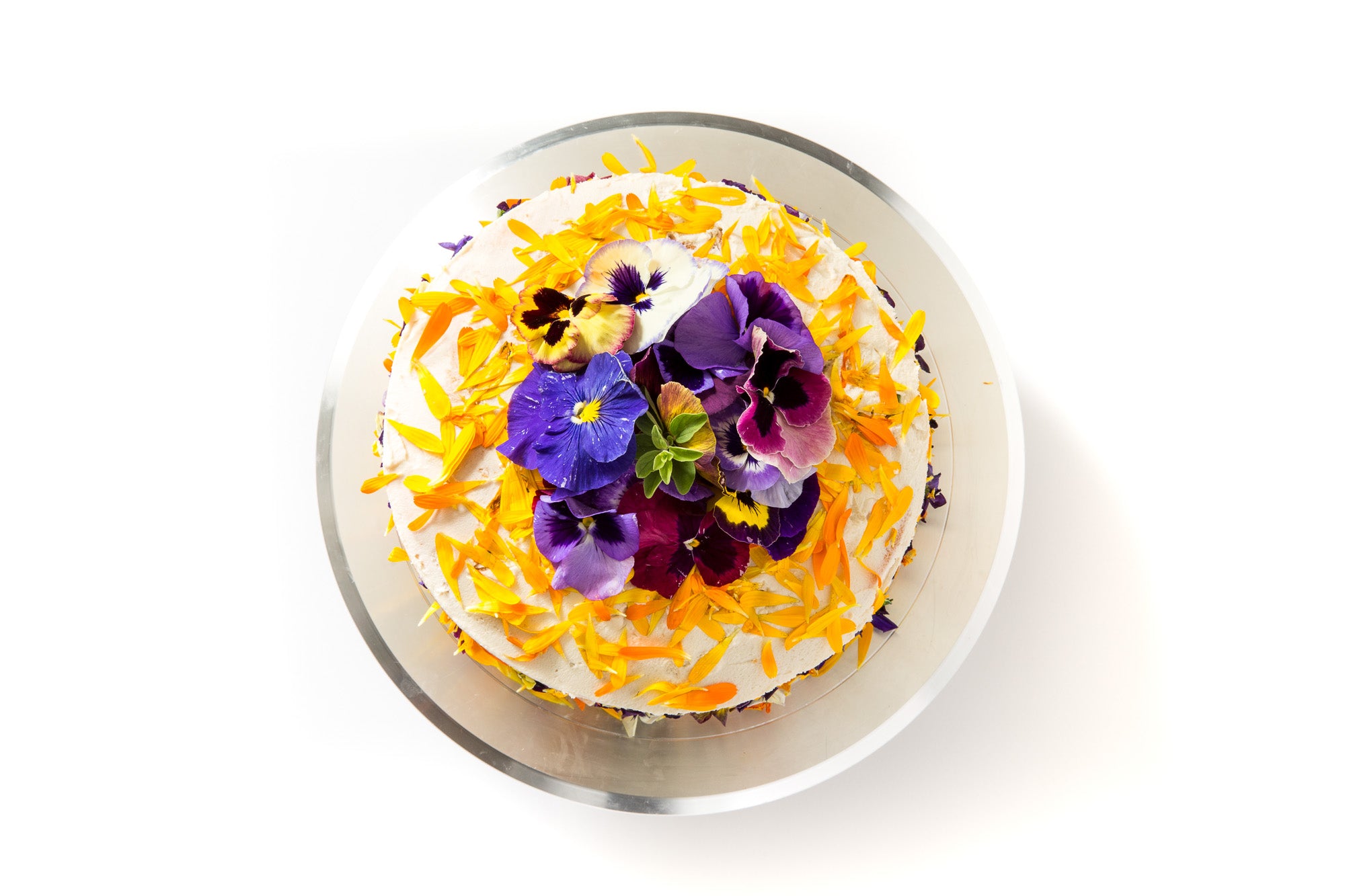 Image of the top of Miss Jones Baking Co Floral Bloom Layer Cake on a cake stand