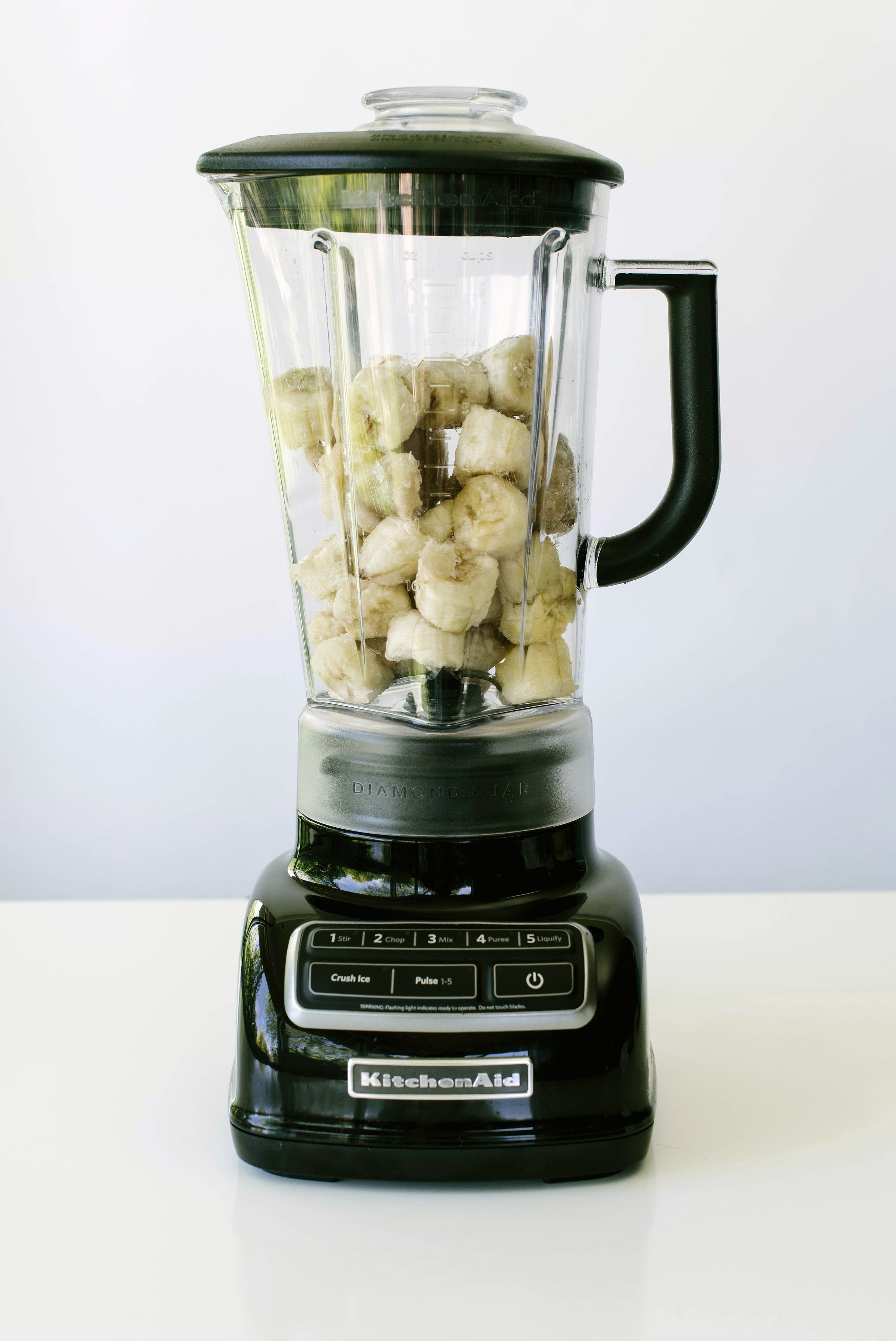 Bananas in a blender used for Miss Jones Baking Co Chocolate Cake Batter Peanut Butter Nice Cream recipe