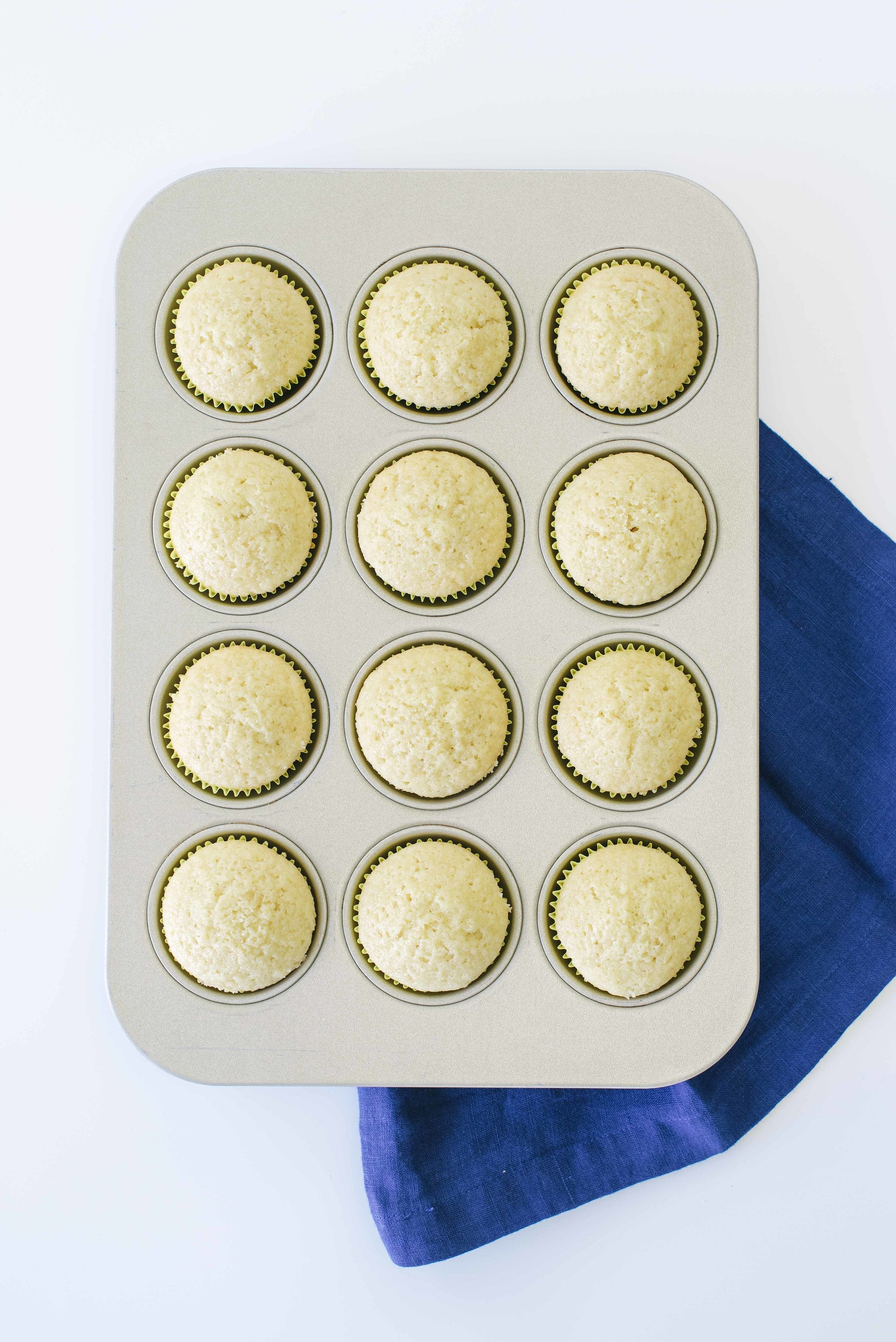 Image of top of baking tray with Miss Jones Baking Co Confetti Pop Cream Puff Cupcakes