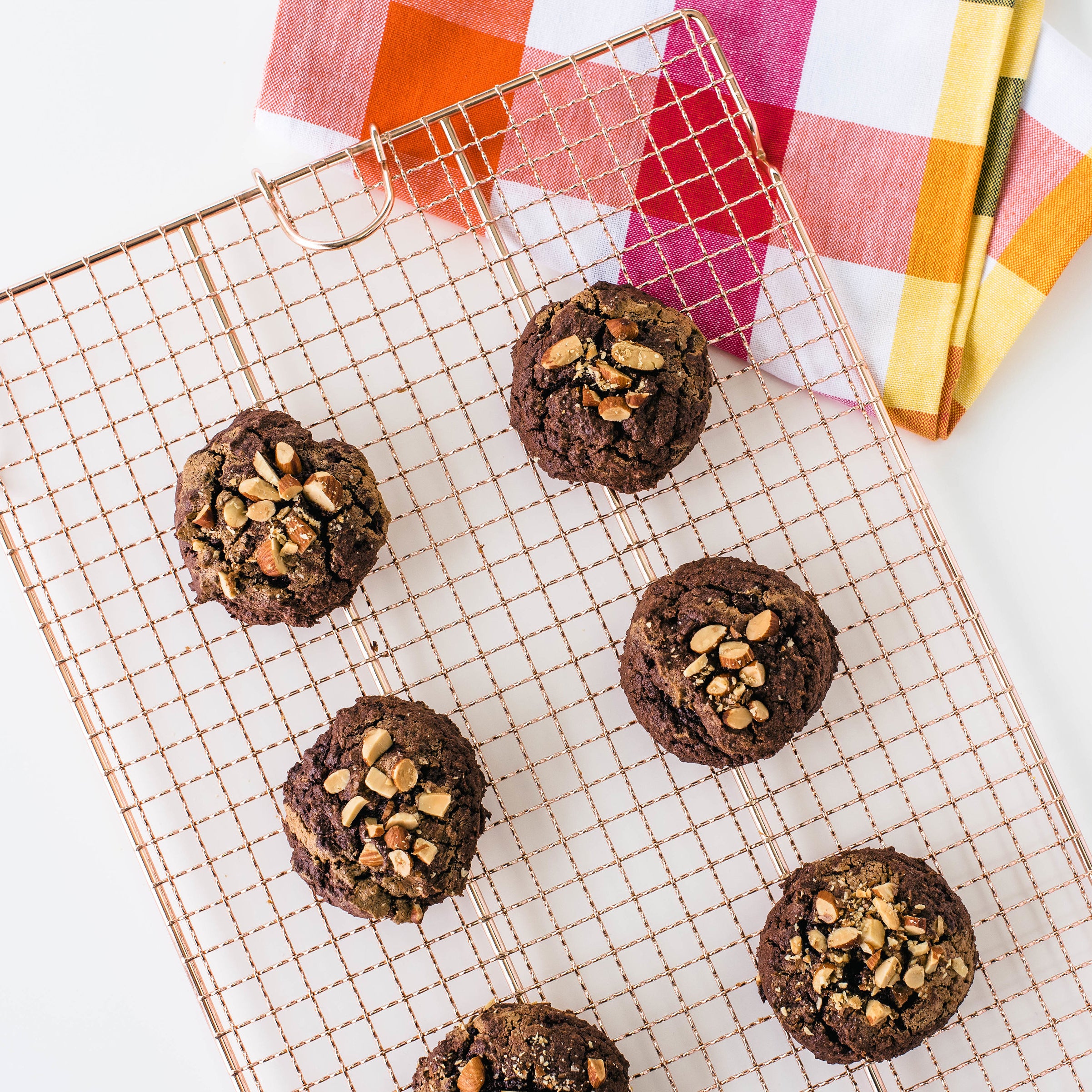 Six Miss Jones Baking Co Almond Butter Swirl Cookies on copper baking rack