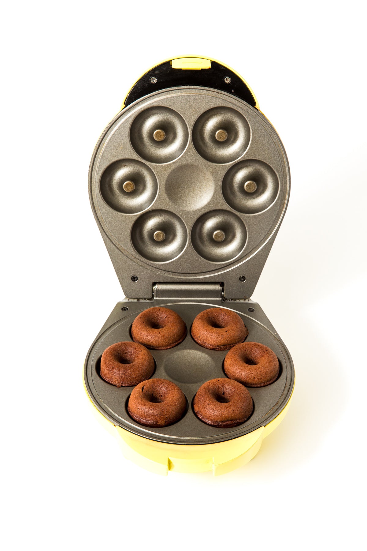 Image of six Miss Jones Baking Co Guinness Glazed Chocolate Donuts in a donut maker mold