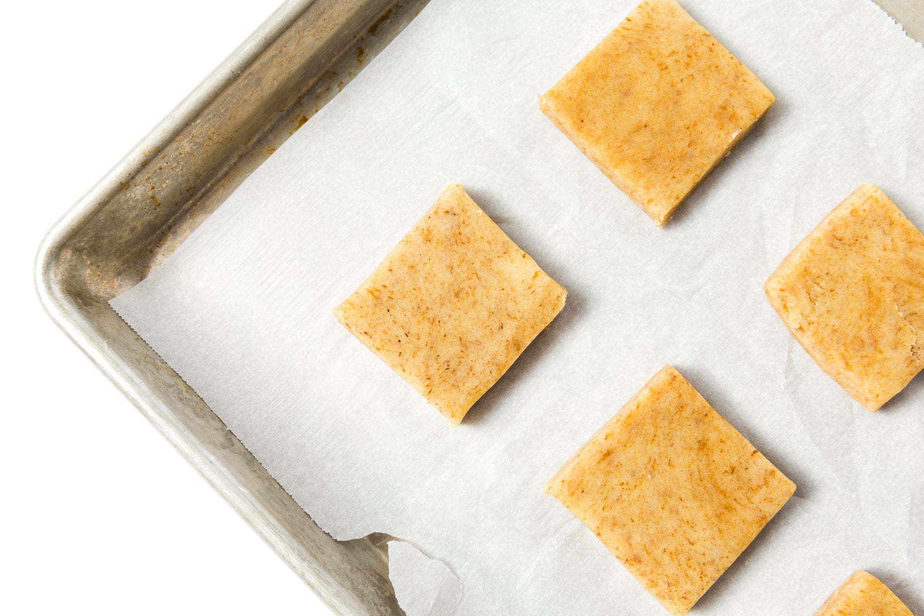 Image from above of four Miss Jones Baking Co Black + White Espresso Shortbread Bars on a baking sheet