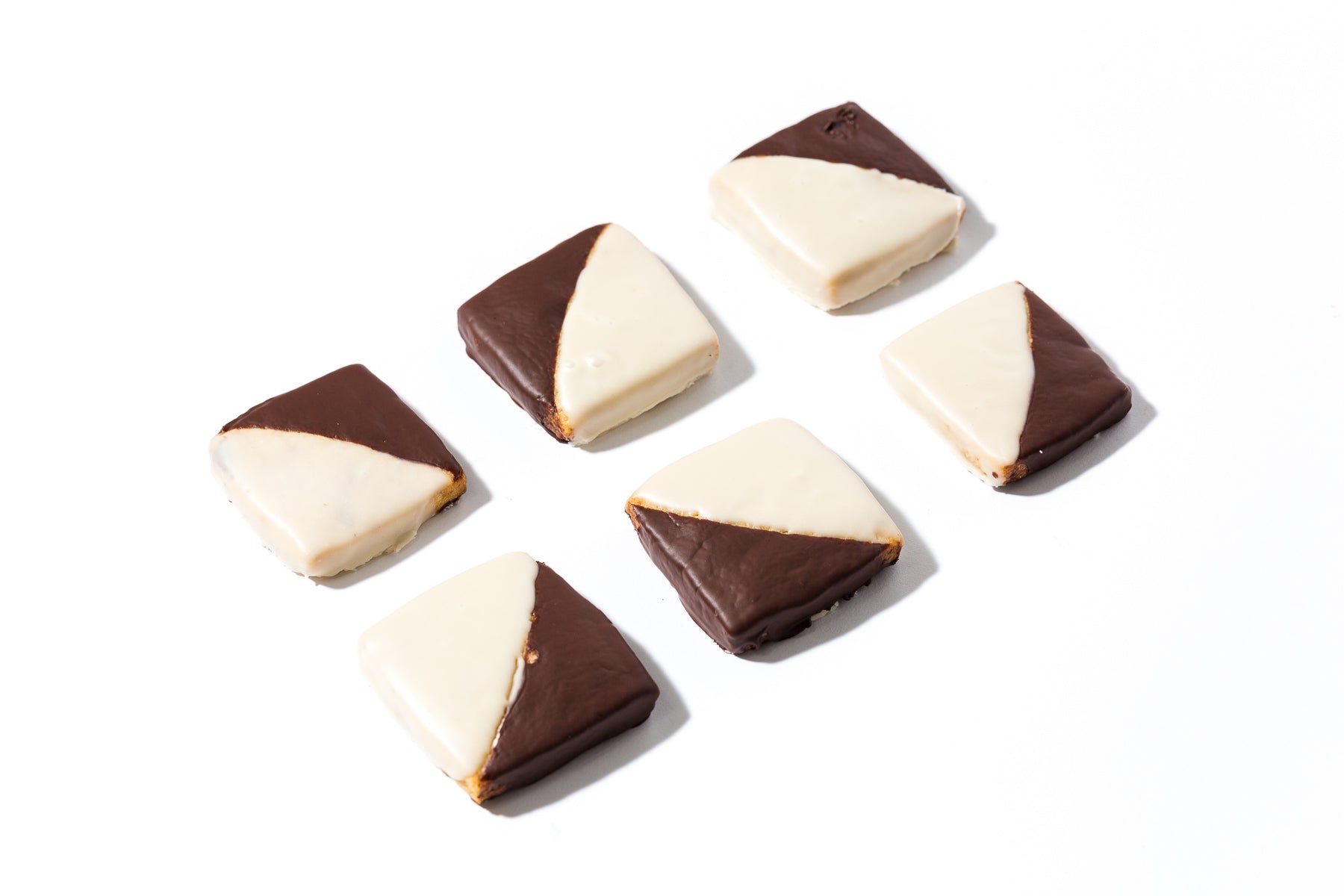 Image from above of six finished Miss Jones Baking Co Black + White Espresso Shortbread Bars