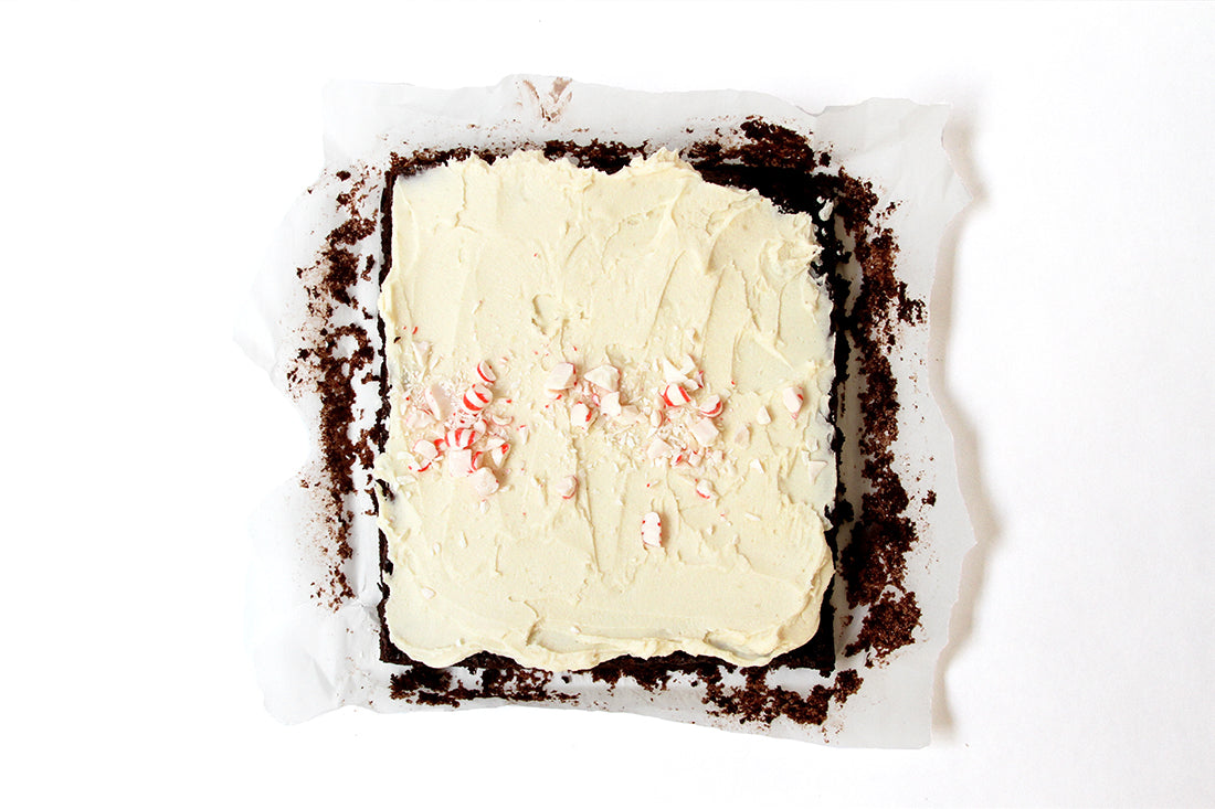 Image from above of frosted brownies in a baking pan for Miss Jones Baking Co Peppermint Bark Brownies