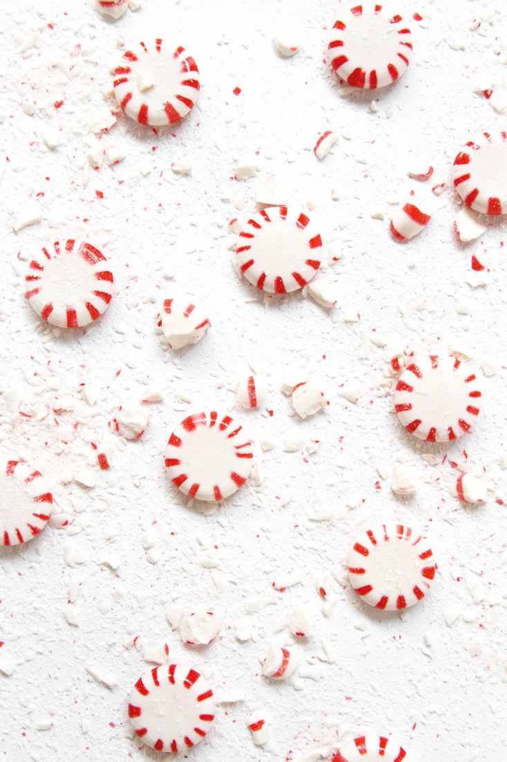 Image of peppermint candies surrounded by crushed peppermint candies for Miss Jones Baking Co Peppermint Bark Brownies