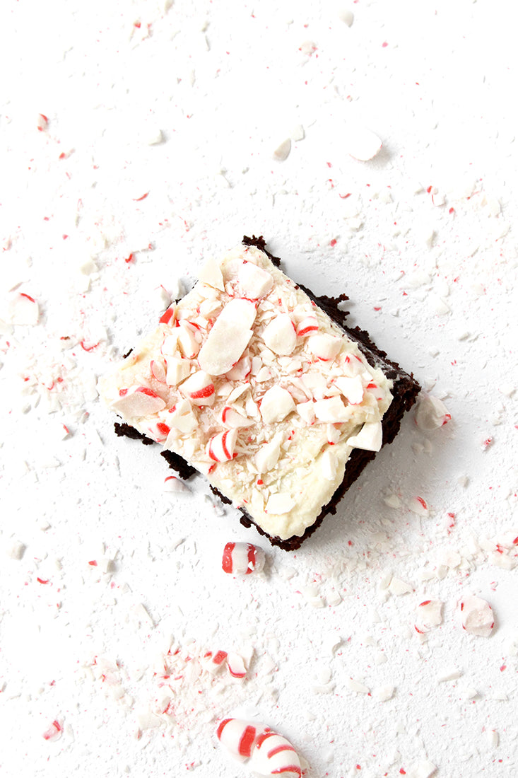 Image from above of a Miss Jones Baking Co Peppermint Bark Brownie surrounded by crushed peppermints