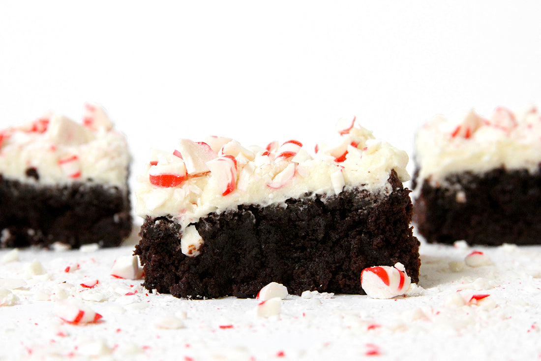 Image of the side of three Miss Jones Baking Co Peppermint Bark Brownies