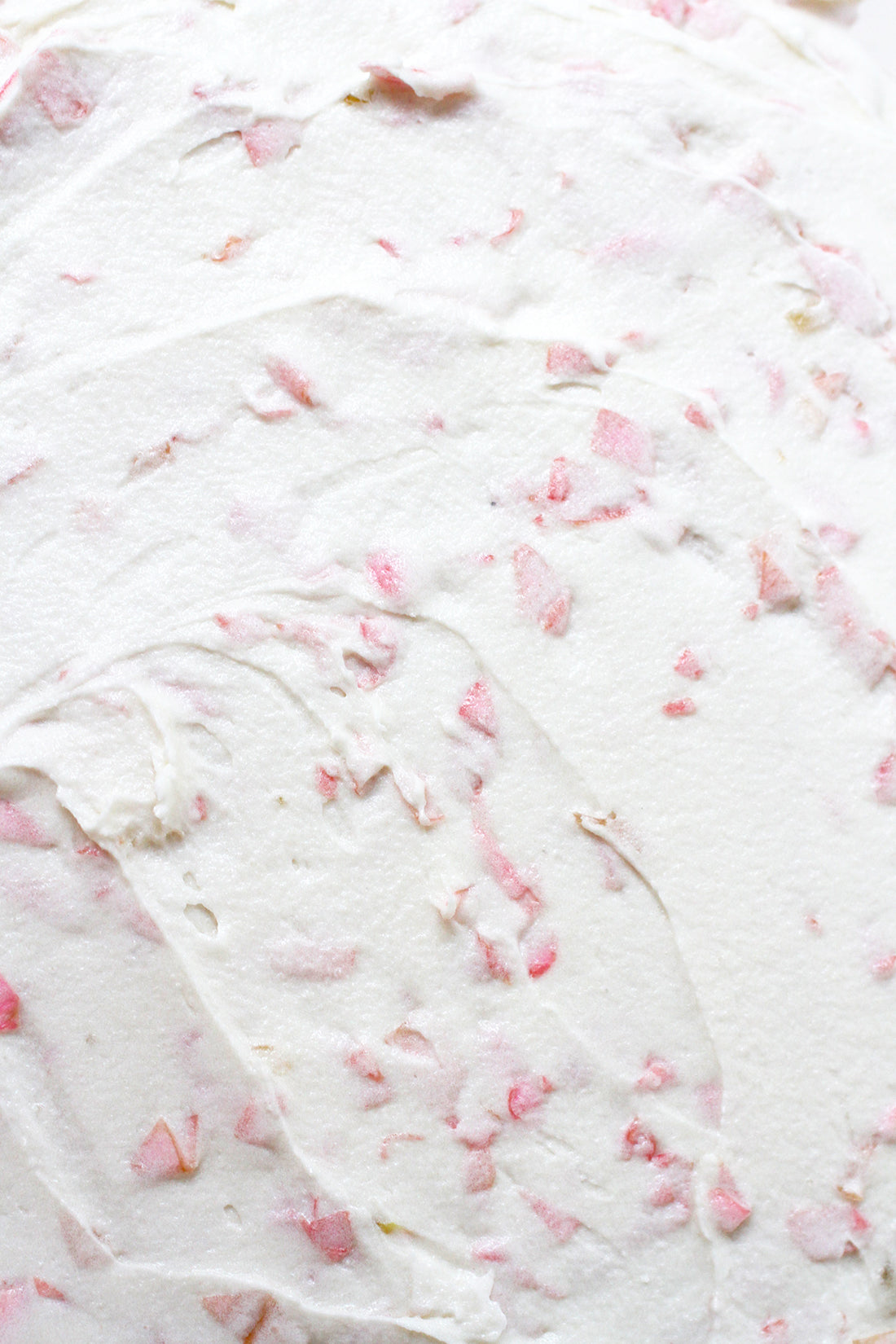 Close up image of rose petals in frosting for Miss Jones Baking Co Rosé All Day Rose Cake