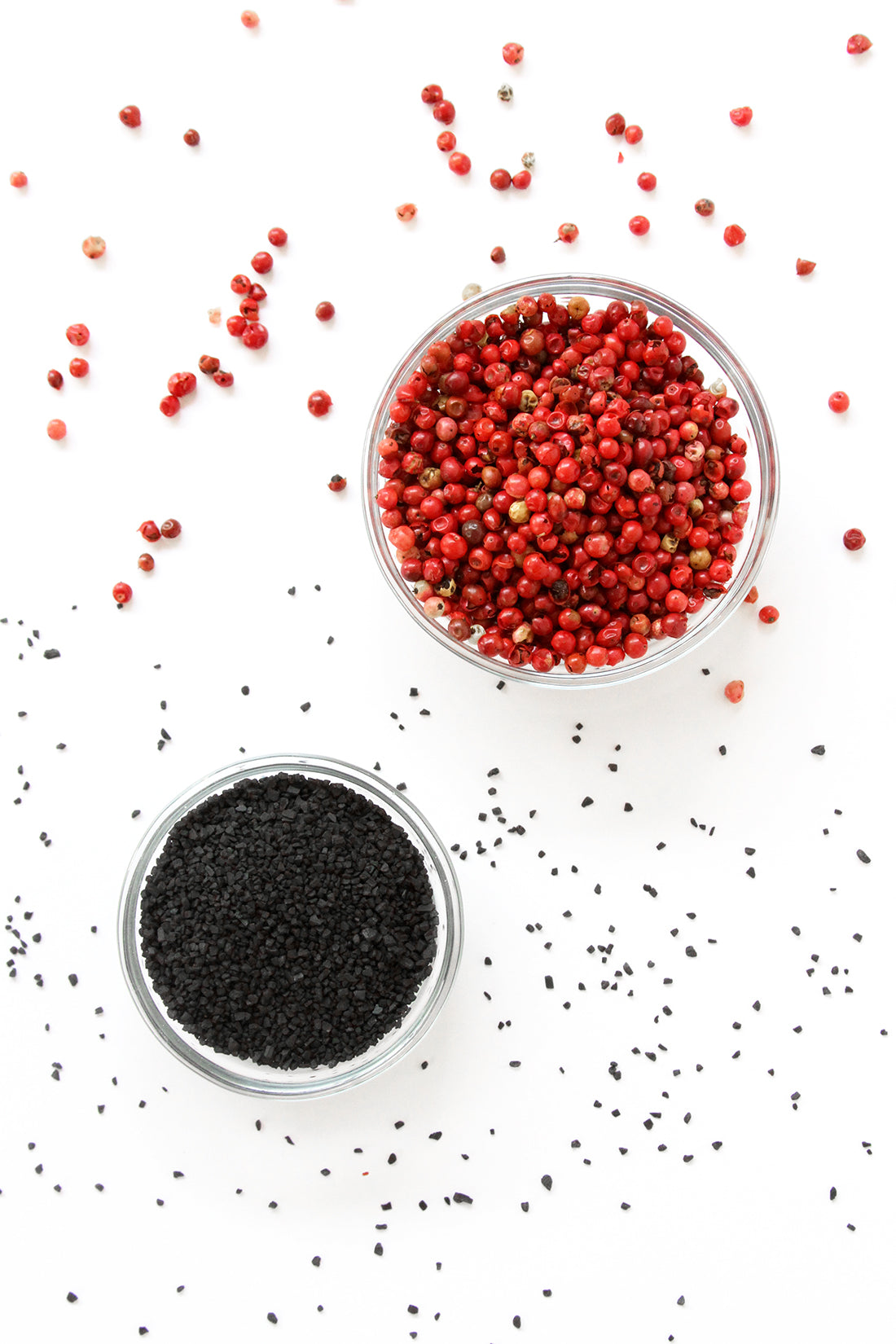 Image from above of two bowls of red and black peppercorn balls for Miss Jones Baking Co Salt + Pepper Shortbread recipe