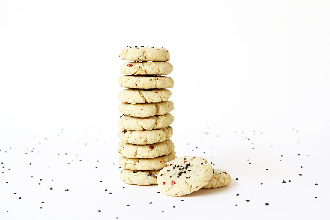 Image of the side of a stack of Miss Jones Baking Co Salt + Pepper Shortbread cookies
