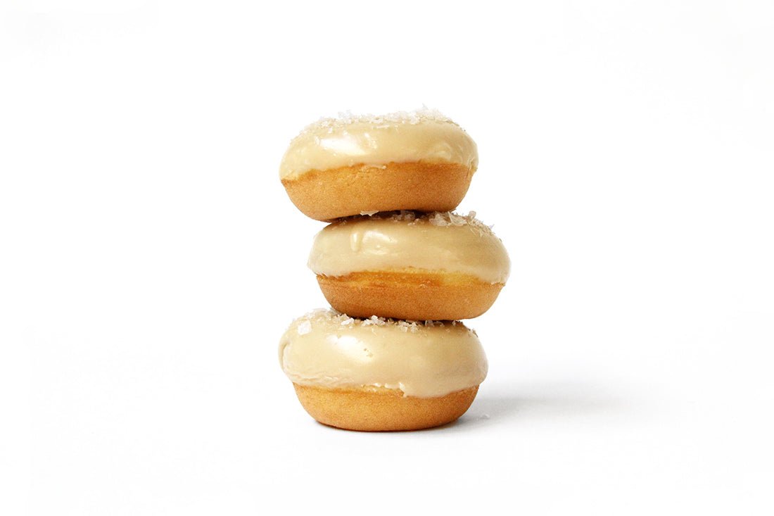 Image of three Miss Jones Baking Co Salted Maple Donuts stacked