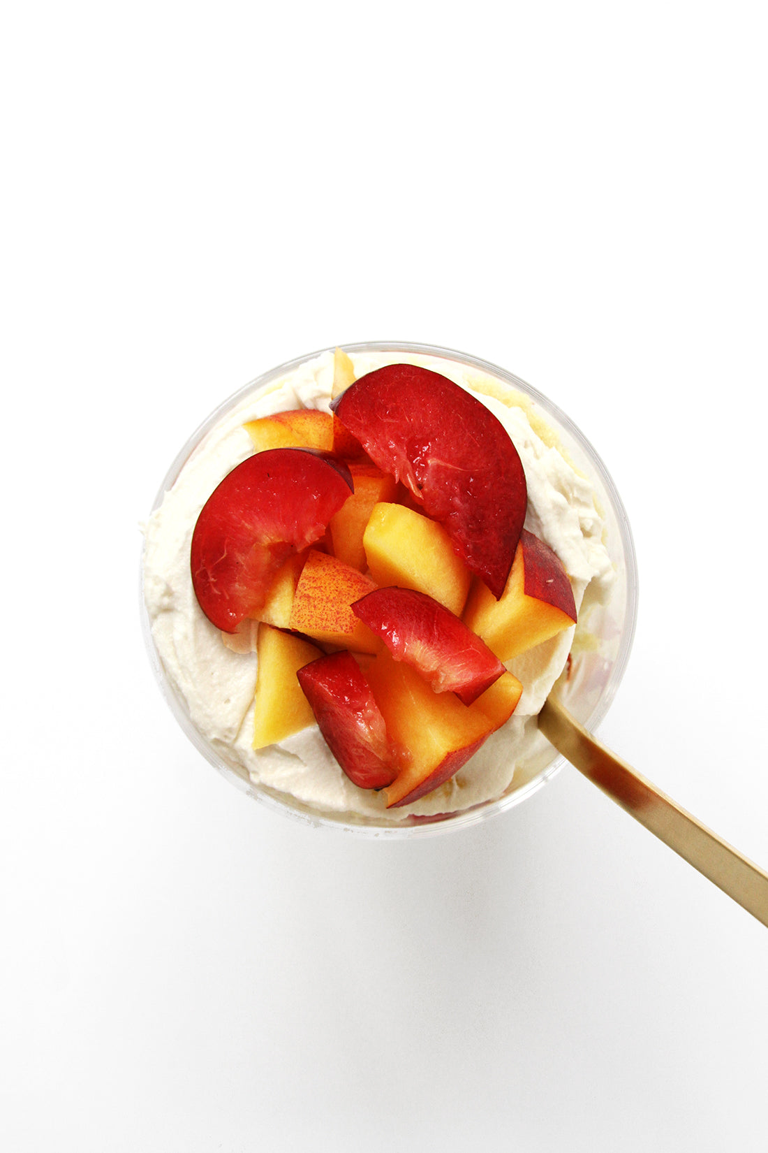 Image of the top of Miss Jones Baking Co Stone Fruit Shortcake with a gold spoon inside