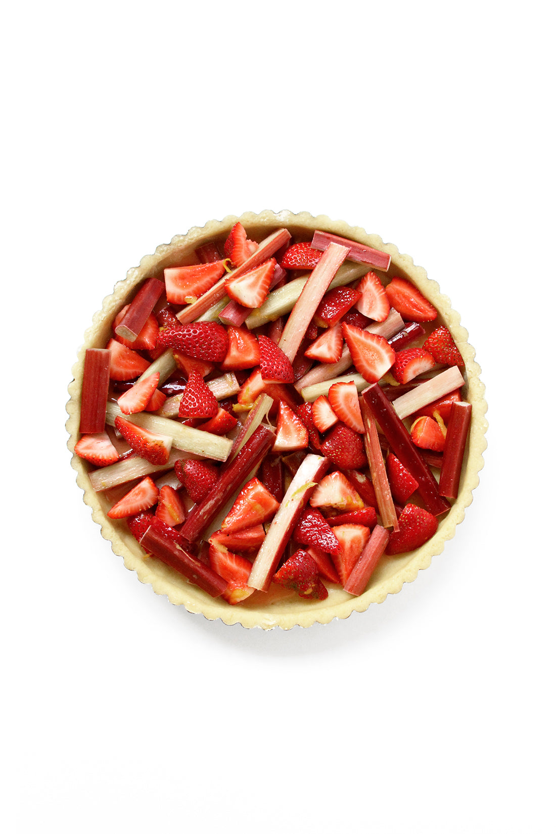 Image from above of an uncooked Miss Jones Baking Co Summer Strawberry + Rhubarb Tart