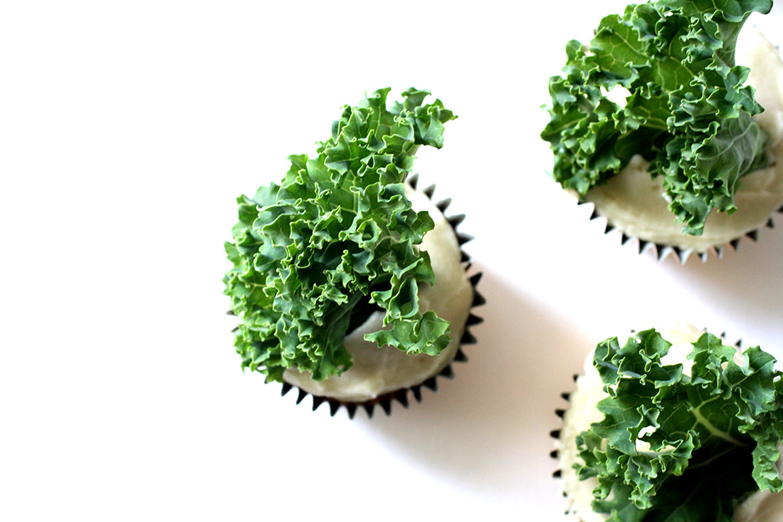 Image from above of three Miss Jones Baking Co Sweet Kale Cupcakes