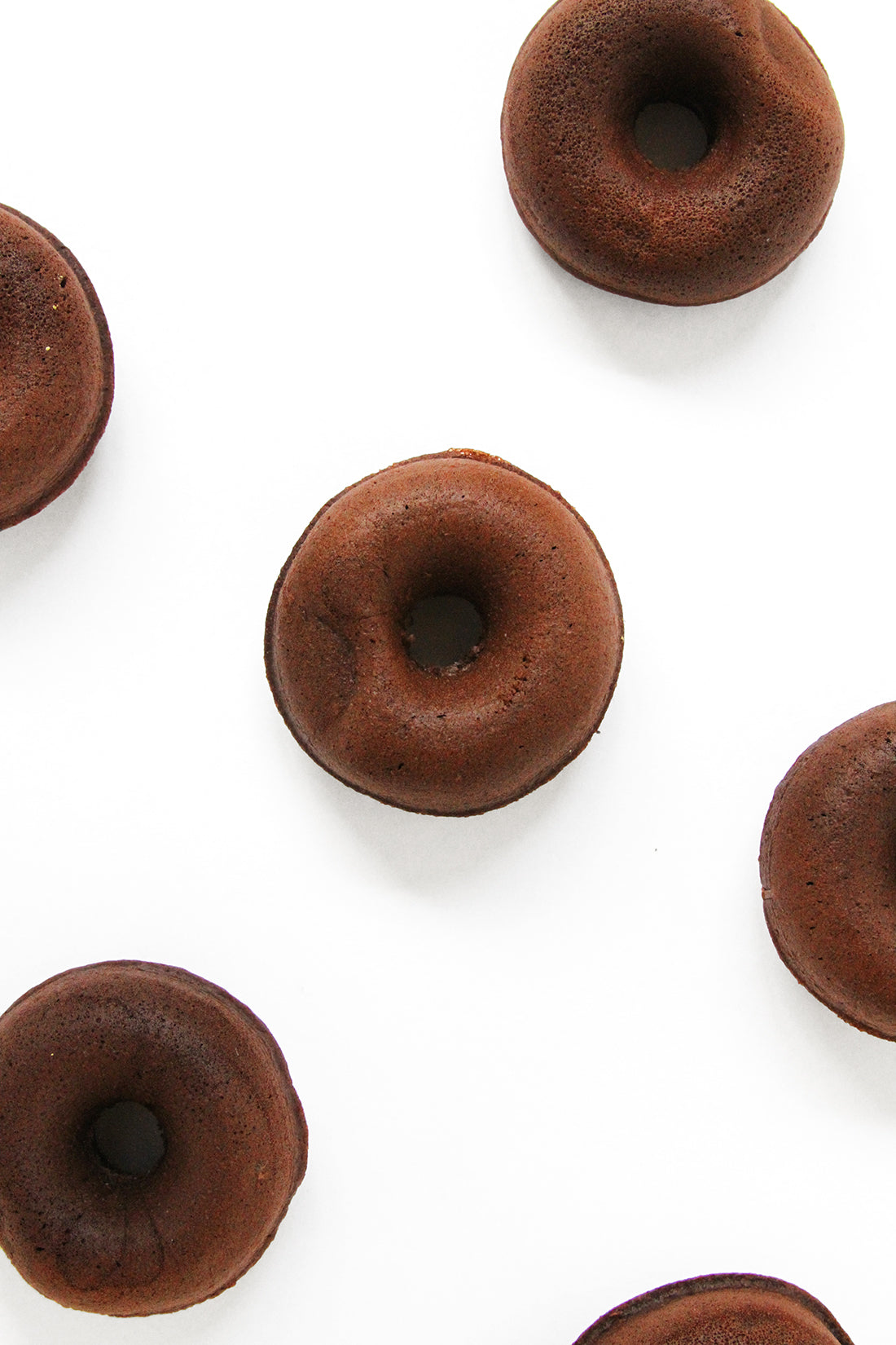 Image from above of unfrosted Miss Jones Baking Co Thin Mint Donuts