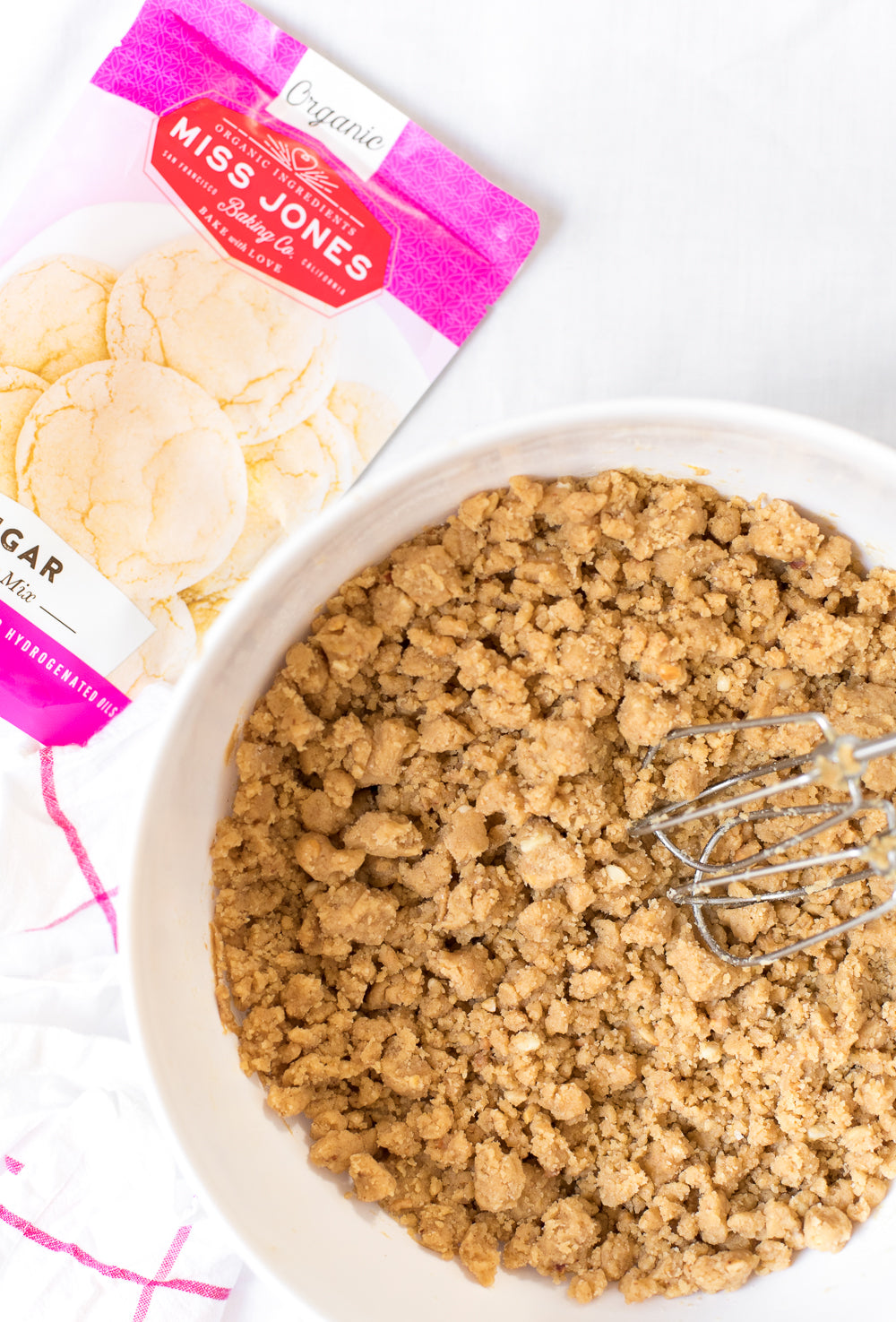 Image of top of mixing bowl with ingredients for Miss Jones Baking Co Perfectly Chewy Peanut Butter & Jelly Cookie Sandwiches