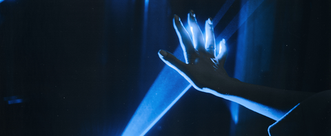 hand blocking blue light