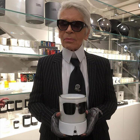 Karl Lagerfeld at Colette holding is Candle Karl
