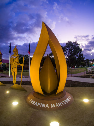 Flame sculpture on a plinth with Aboriginal Soldier Figure 