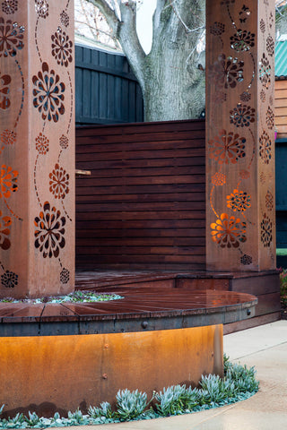 Custom made Pergola out of Laser cut Corten with custom curve bench 