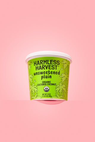 harmless harvest unsweetened coconut yogurt on pink background