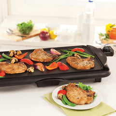electric griddle with meat and vegetables