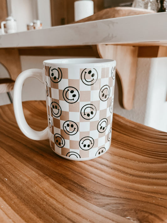 https://cdn.shopify.com/s/files/1/0417/7664/4246/products/smiley-face-checkered-coffee-mug-711187.jpg?v=1693087854&width=533