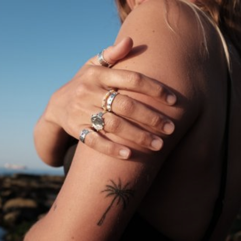 Sun Baby Silver Rings Displayed on Hand