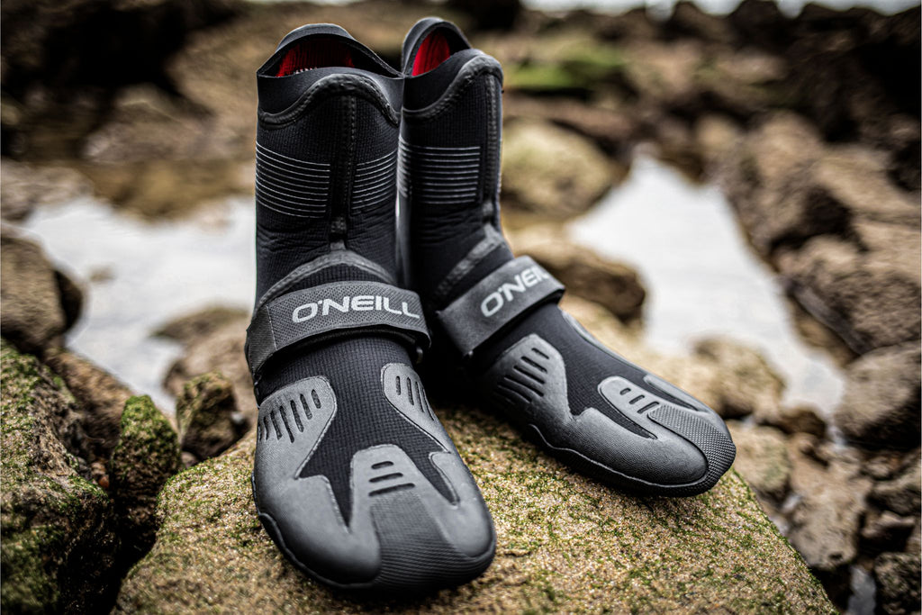 Picture of O'Neill Psycho Tech 5mm neoprene boots on moss covered seaside rocks