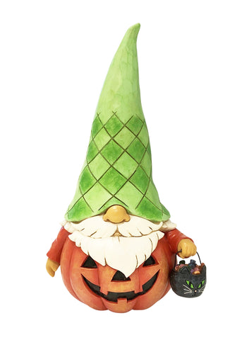 This charming Halloween gnome from Jim Shore trick or treats with a black cat candy pail and pumpkin costume. His patchwork patterned green hat creates the stem of the pumpkin while he wears a jack-o-lantern face on an orange shirt across his big belly.