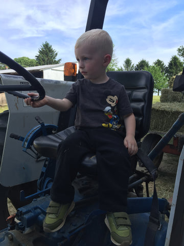 Little future farmer grandson Silas wanting to drive the tractor