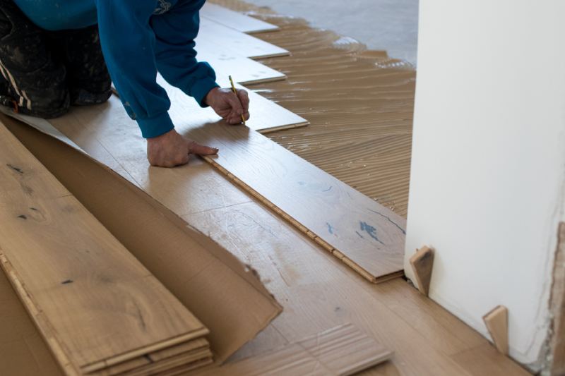 A photo showing how to glue down engineered flooring