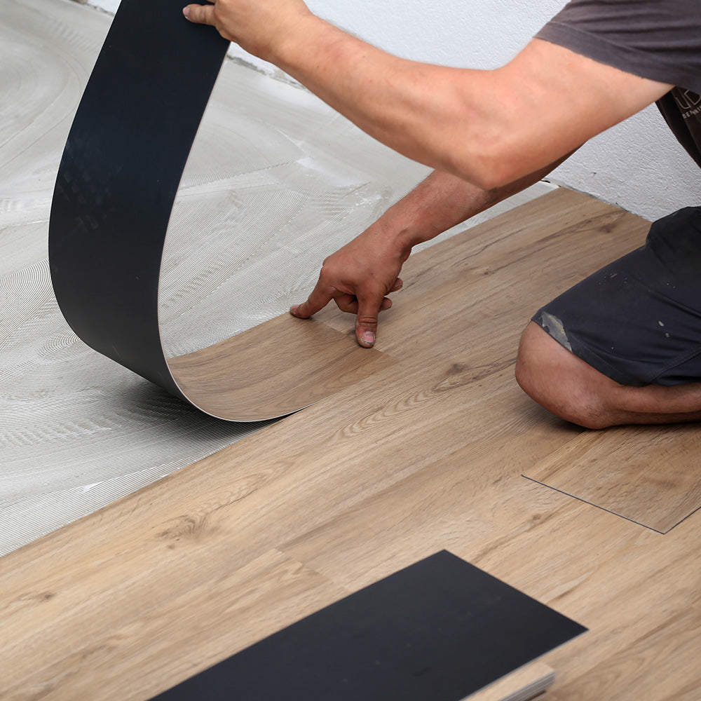 LVT Vs Engineered Wood Flooring - Installing LVT flooring by Stories Flooring