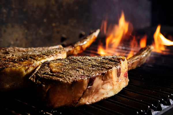 searing tomahawk on the grill