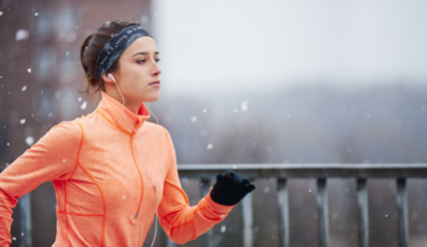 Woman running outdoors in winter