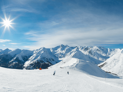 sonne in den bergen bei schnee und eis