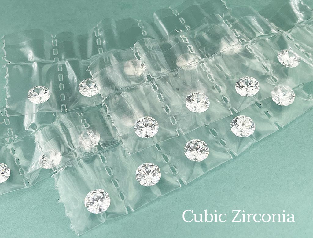 Cubic zirconia is manufactured in large quantities so it is inexpensive.