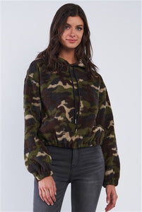 Image of a hoodie sweater with a dark olive camo print and soft, plush texture.