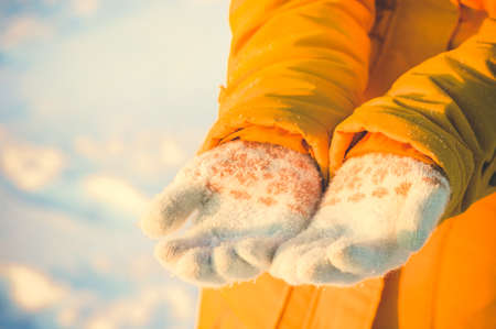 wearing warm gloves outside to help dry skin